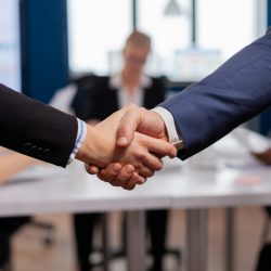 Satisfied businessman company employer wearing suit handshake new employee get hired at job interview, Man hr manager employ successful candidate shake hand at business meeting, placement concept